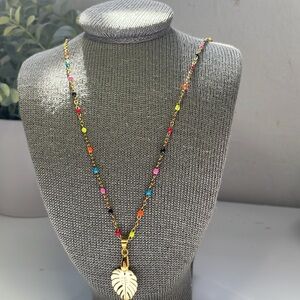 NWT Tropical leaf necklace and pendant stainless steel colored beads.  25’in